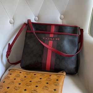 Nice used coach bag brown W/ black C’s, Red strap
